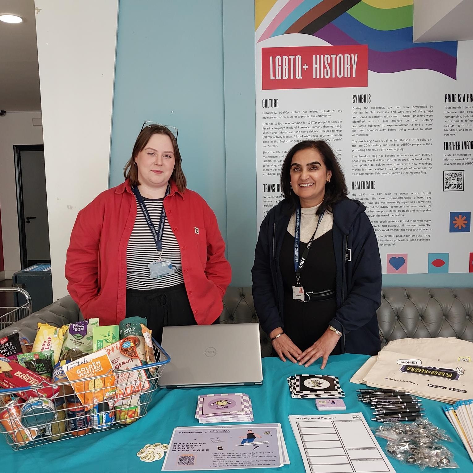 Photo of the student funding team hosting a drop in session in the café bar at Leeds Conservatoire.